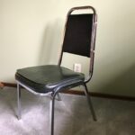 6 chrome chairs with green vinyl upholstery